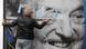 Activists of Egyutt (Together) opposition party removes a government billboard displaying George Soros in monochrome Activists of Egyutt (Together) opposition party removes a government billboard displaying George Soros in monochrome