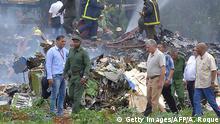 Cuban President Miguel Diaz-Canel (2-R, in khaki) is pictured at the site of the accident after a Cubana de Aviacion aircraft crashed after taking off from Havana's Jose Marti airport on May 18, 2018. - A Cuban state airways passenger plane with 104 passengers on board crashed on shortly after taking off from Havana's airport, state media reported. The Boeing 737 operated by Cubana de Aviacion crashed near the international airport, state agency Prensa Latina reported. Airport sources said the jetliner was heading from the capital to the eastern city of Holguin. (Photo by Adalberto ROQUE / AFP) (Photo credit should read ADALBERTO ROQUE/AFP/Getty Images)