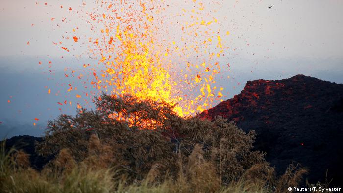 Lava erupts on the outskirts of Pahoa during ongoing eruptions of the Kilauea volcano in Hawaii (Reuters/T. Sylvester)