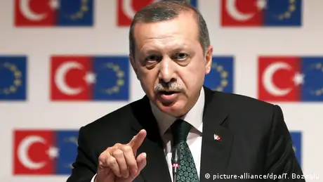 Erdogan in front of an amalgamation of Turkish and EU flags