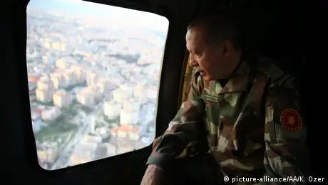 Erdogan in military uniform in a helicopter
