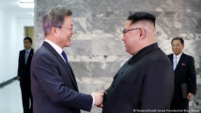 South Korean President Moon (R) with North Korean leader Kim Jong Un