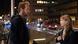 A man and a woman talk in the street at night A man and a woman talk in the street at night