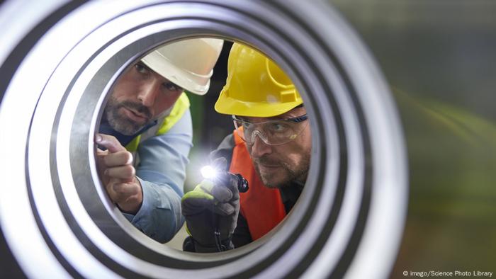 Engineers check the condition of the pipe