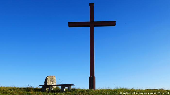 A cross stands alongside a hiking trail in southwestern Germany