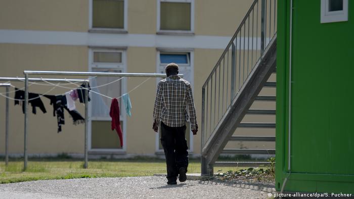 Man walking outside asylum center in Manching, Bavaria