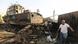 Workers inspect the bombed out remains of a boat at a maintenance hub at the port of Hodeida. Workers inspect the bombed out remains of a boat at a maintenance hub at the port of Hodeida.