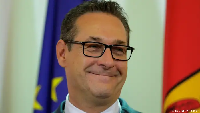 Smiling Heinz-Christian Strache addresses reporters in Vienna (Reuters/H. Bader)