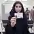 A Saudi Arabian woman holds up her new driver's license