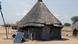 A hut in South Sudan with a solar panel A hut in South Sudan with a solar panel