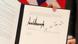As assinaturas de Donald Trump e Kim Jong-un no documento com a declaração conjunta As assinaturas de Donald Trump e Kim Jong-un no documento com a declaração conjunta