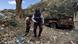 Two journalists next to a bombed-out vehicle in Taiz Two journalists next to a bombed-out vehicle in Taiz