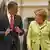 Obama and Merkel walking together in Dresden