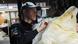 A Canadian wildlife offier inspects a Polar Bear skin A Canadian wildlife offier inspects a Polar Bear skin