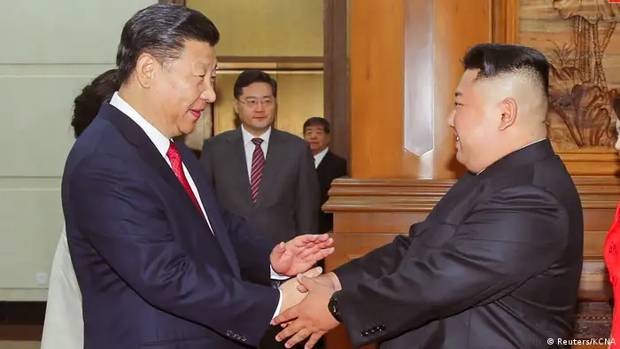 Chinese President Xi Jinping shakes hands with North Korean leader Kim Jong Un in Beijing (Reuters/KCNA)