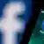 Facebook logo on a smartphone screen