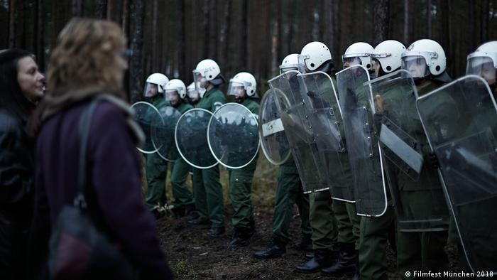 A line of cops in riot gear in a film still (Filmfest München 2018)