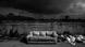 Black sky above a landfill with a sofa in the middle Black sky above a landfill with a sofa in the middle