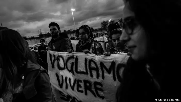 A group of people holding a banner (Stefano Schirato)