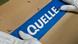 Hands smoothing down parcel tape bearing Quelle name on to cardboard box Hands smoothing down parcel tape bearing Quelle name on to cardboard box