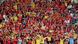 Na arquibancada do estádio de Kaliningrado, torcedores vestidos de amarelo, vermelho e preto durante partida da seleção belga contra a Inglaterra Na arquibancada do estádio de Kaliningrado, torcedores vestidos de amarelo, vermelho e preto durante partida da seleção belga contra a Inglaterra