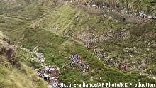 In this grab made from video provided by KK Productions, shows the area of a deadly bus accident in Uttarakhand's Paudi Garhwal district, northern India, Sunday, July 1, 2018. Chief Minister of Uttarakhand state Trivendra Rawat said the bus fell into a 700-foot (213-meter) deep gorge in the Himalayan foothills. (KK Production via AP) |