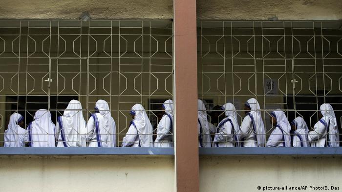 Nuns from Mother Teresa's Missionaries of Charity order standing in a line in Kolkata