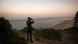 A Guardia Civil officer uses binoculars to search for boats with migrants A Guardia Civil officer uses binoculars to search for boats with migrants