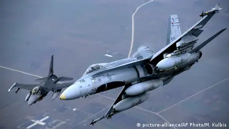 Fighter jets from Portugal and Canada take part in a policing mission in Lithuanian airspace