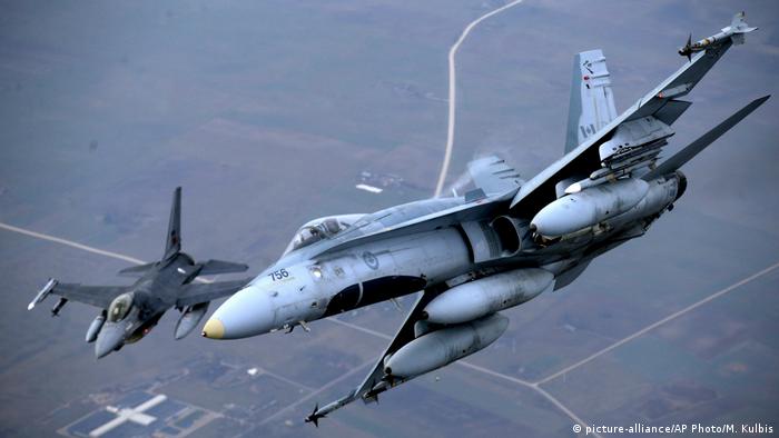 Fighter jets from Portugal and Canada take part in a policing mission in Lithuanian airspace