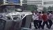 Uighur protestors turn over a police car Uighur protestors turn over a police car