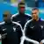France players  N'Golo Kante, Kylian Mbappe and Paul Pogba warm up