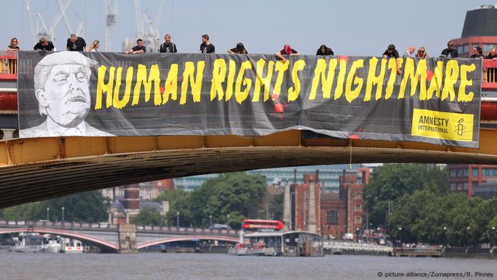 Anti-Trump sign reading human rights nightmare