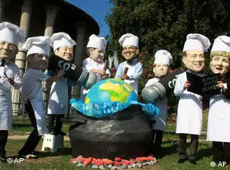 Activists wearing masks of G-8 leaders from left; French President Nicolas Sarkozy, British Prime Minister Gordon Brown, Japanese Prime Minister Taro Aso, Canadian Prime Minister Stephen Harper, US President Barack Obama, Russian President Dmitry Medvedev, Italian Premier Silvio Berlusconi and German Chancellor Angela Merkel, and dressed as chefs cook the planet in a fake cauldron as they stage a demonstration against the G-8 (Group of Eight) summit scheduled from July 8 to July 10 in L'Aquila, Italy.