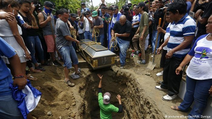 Friends and family bury a student who was killed during a pro-government attack on the National University of Managua