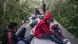 Migrants stand and sit on top of the so-called "Beast," the freight train that travels across Mexico, from Guatemala to the US border Migrants stand and sit on top of the so-called "Beast," the freight train that travels across Mexico, from Guatemala to the US border