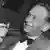 Dag Hammarskjoeld shortly after his nomination as UN secretary-general, smoking a pipe