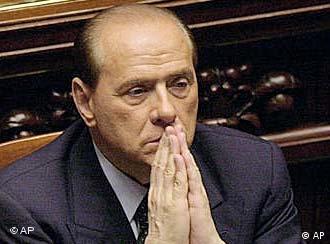Back in the hot seat -- Italian Prime Minister Silvio Berlusconi.