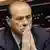 Italian premier Silvio Berlusconi listens to opposition members statements after his address in Parliament's lower chamber on the resignation of foreign minister Renato Ruggiero, in Rome, Monday Jan. 14, 2002. In a TV show Tuesday Jan. 15, night, media magnate Berlusconi said he is adopting for his cabinet ministers one of the private-sector techniques that made him Italy's richest man: "Prizes or sanctions" depending on how the "very precise tasks" given to the ministers are carried out. Berlusconi did not reveal what the prizes - or punishments - would be. (AP Photo/Corrado Giambalvo)