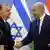 Hungarian Prime Minister Viktor Orban shakes hands with Israeli Prime Minister Benjamin Netanyahu