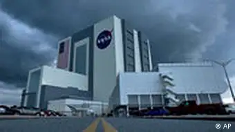 In this photo provided by NASA, storm clouds roll over NASA's vehicle assembly building moments after the lauch of space shuttle Endeavor was scrubbed at Kennedy Space Center in Cape Canaveral, Fla., Sunday, July 12, 2009. (AP Photo/NASA, Bill Ingalls) ** MANDATORY CREDIT **