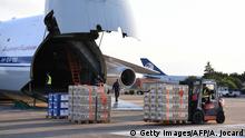 Crates containing humanitarian aid are loaded onto an Antonov An-124 Ruslan - Widebody at the former Chateauroux-Deols Marcel Dassault Airport in central France on July 20, 2018. - France and Russia are jointly delivering humanitarian aid to the former Syrian rebel enclave of Eastern Ghouta, the French Presidency said in a statement with Russia on July 20. A Russian cargo plane arrived late in Chateauroux to load 50 tons of medical equipment and essential goods provided by France, said an AFP videographer at the scene, to be transported to the former rebel area which was recaptured by Syrian troops this Spring. (Photo by Alain JOCARD / AFP) (Photo credit should read ALAIN JOCARD/AFP/Getty Images)