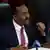 Ethiopia's Prime Minister Abiy Ahmed speaks into a microphone