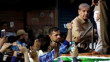 26.06.2018 *** Supporters of Shahbaz Sharif, brother of ex-prime minister Nawaz Sharif, and leader of Pakistan Muslim League - Nawaz (PML-N) use their mobile phones to take photos of him during a campaign rally ahead of general elections in the Lyari neighborhood in Karachi, Pakistan June 26, 2018. REUTERS/Akhtar Soomro