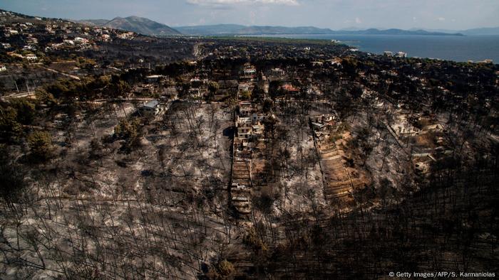 Aerial shot of burnt area following wildfire in Greece