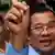 Cambodia's Prime Minister and President of the Cambodian People's Party (CPP) Hun Sen shows his stained finger