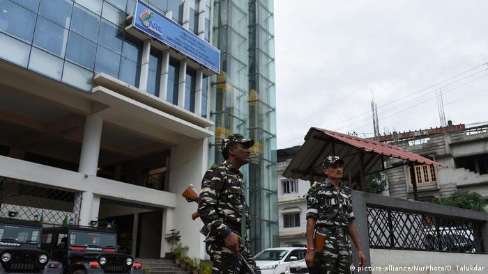 Security forces stand guard outside the National Register of Citizens building in Gauhati, Assam