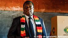 30.07.2018 *** Zimbabwe President and candidate Emmerson Mnangagwa stands after casting his ballot at Sherwood Primary School in Kwekwe on July 30 2018, during Zimbabwe's 2018 general elections to elect the president and members of Parliament. (Photo by Jekesai NJIKIZANA / AFP) (Photo credit should read JEKESAI NJIKIZANA/AFP/Getty Images)