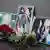 Цветы у фотографий Орхана Джемаля, Александра Расторгуева и Кирилла Радченко