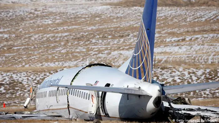 The wreckage of a Continental Airlines plane sits in a ravine